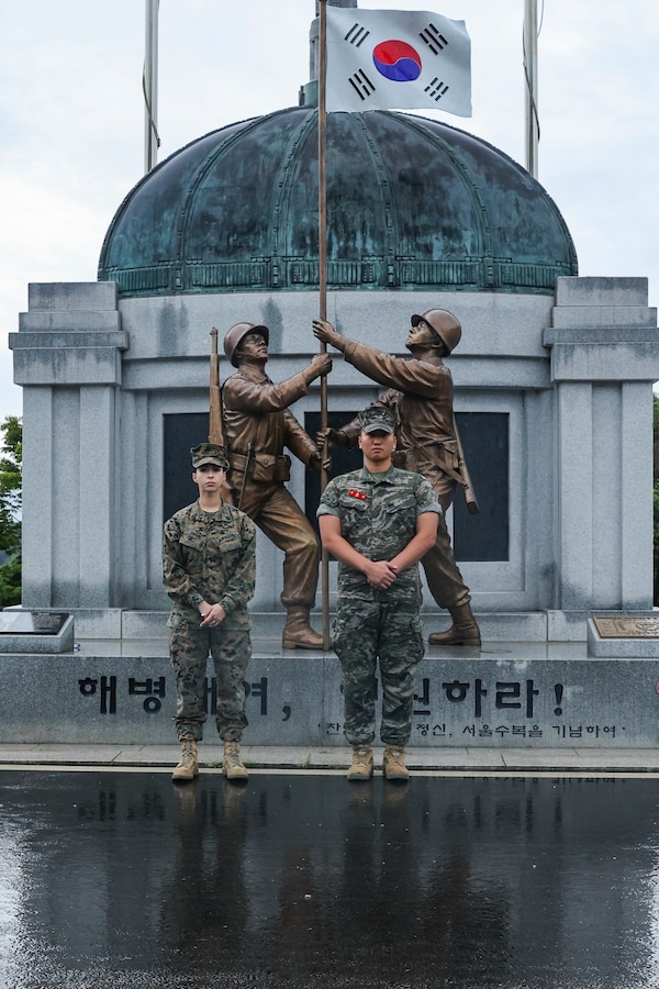 U.S. Marine Corps Sgt. Sophia Green and Republic of Korea Marine Cpl.l Andrew Kim pose for a photo in front of the flagpole and monument at Camp Baran, Republic of Korea Marine Corps Headquarters, during Exercise Ulchi Freedom Shield 23. Green, a San Diego, Calif., native served as the Camp Commandant for UFS 23. Kim, a Daegu, South Korea native, served as a translator on the watch floor of the operations center during UFS 23. Ulchi Freedom Shield is an annual exercise designed to strengthen the combined defense posture and Alliance response capabilities based on scenarios that reflect diverse threats within the security environment. This creates an opportunity for ROK and III MEF Marines to train together while conducting the live, virtual, and constructive exercise events that reaffirming the U.S.’s ironclad commitment to the defense of the ROK. (U.S. Marine Corps photo by Maj. Gabriel Adibe)