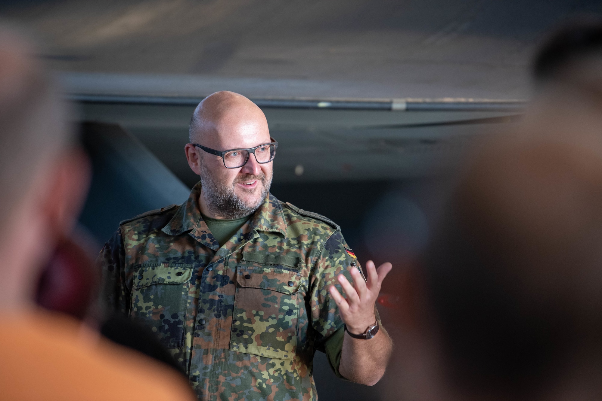 German Bundeswehr Lt. Col. Rafael Intek, Electronic Warfare Battalion 931, Electronic Reconnaissance Squadron commander, briefs members of the German Electronic Warfare Battalion 931, during a base tour at Spangdahlem Air Base, Germany, Sept. 6, 2023.