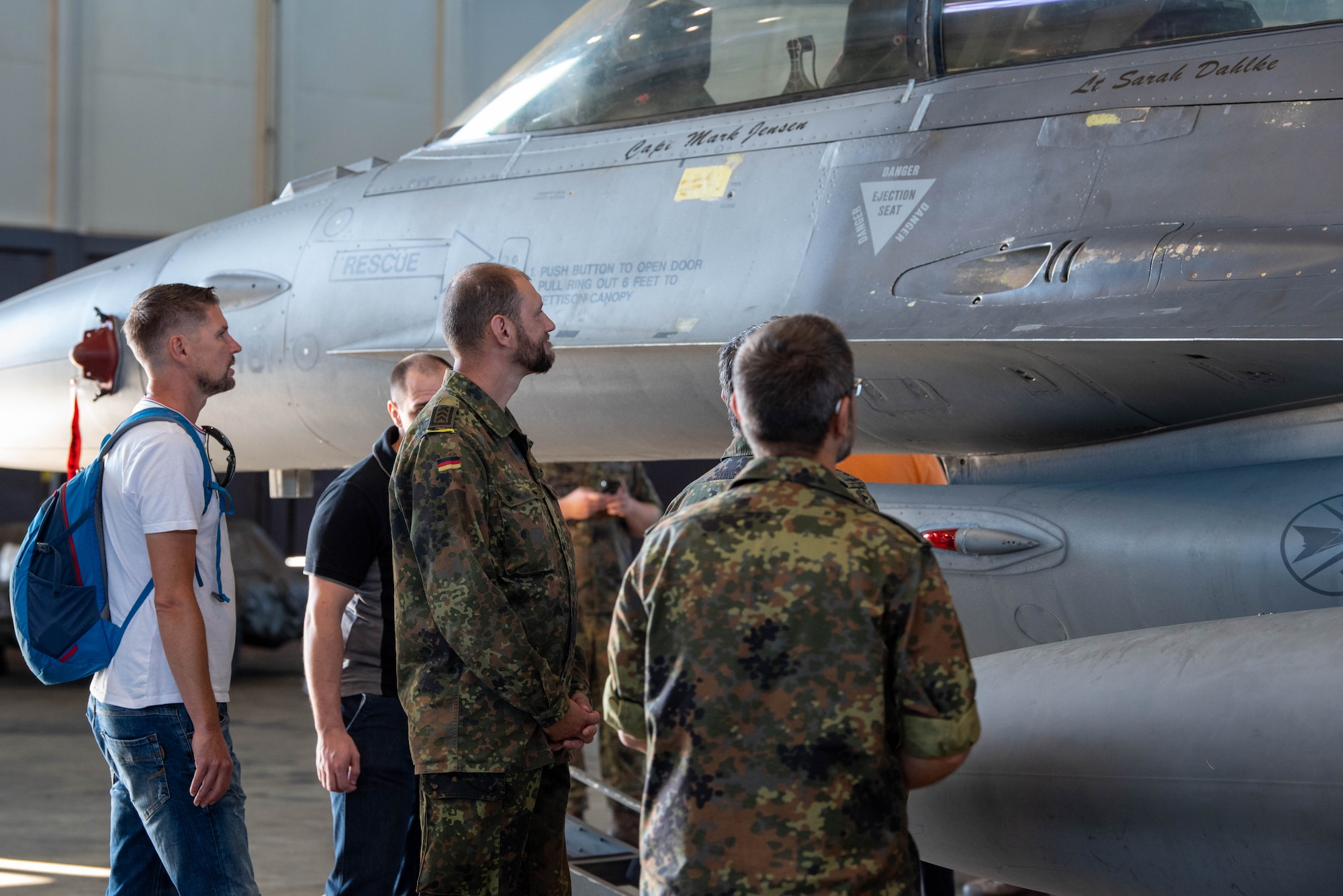 Members of the German Bundeswehr Electronic Warfare Battalion 931, Electronic Reconnaissance Squadron look at a U.S. Air Force F-16D Fighting Falcon assigned to the 52nd Fighter Wing during a base tour at Spangdahlem Air Base, Germany, Sept. 6, 2023
