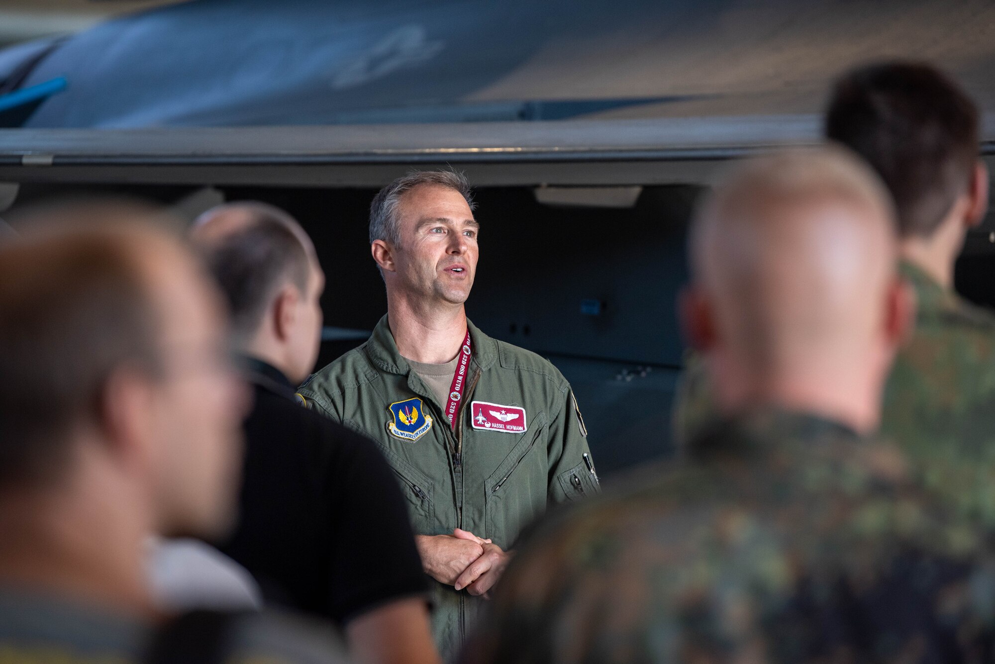 U.S. Air Force Lt. Col. Nathaniel Hofmann, 52nd Operations Support Squadron commander, briefs members of the German Electronic Warfare Battalion 931, Electronic Reconnaissance Squadron, during a base visit at Spangdahlem Air Base, Germany, Sept. 6, 2023.