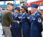 Army General Dan Hokanson, Chief of the National Guard Bureau, thanks New York Air National Guard Sgt. Tiffany Stewart, an air transportation specialist assigned to the 105th Airlift Wing in Newburgh, N.Y., following his administering her oaths of service in Times Square, New York City