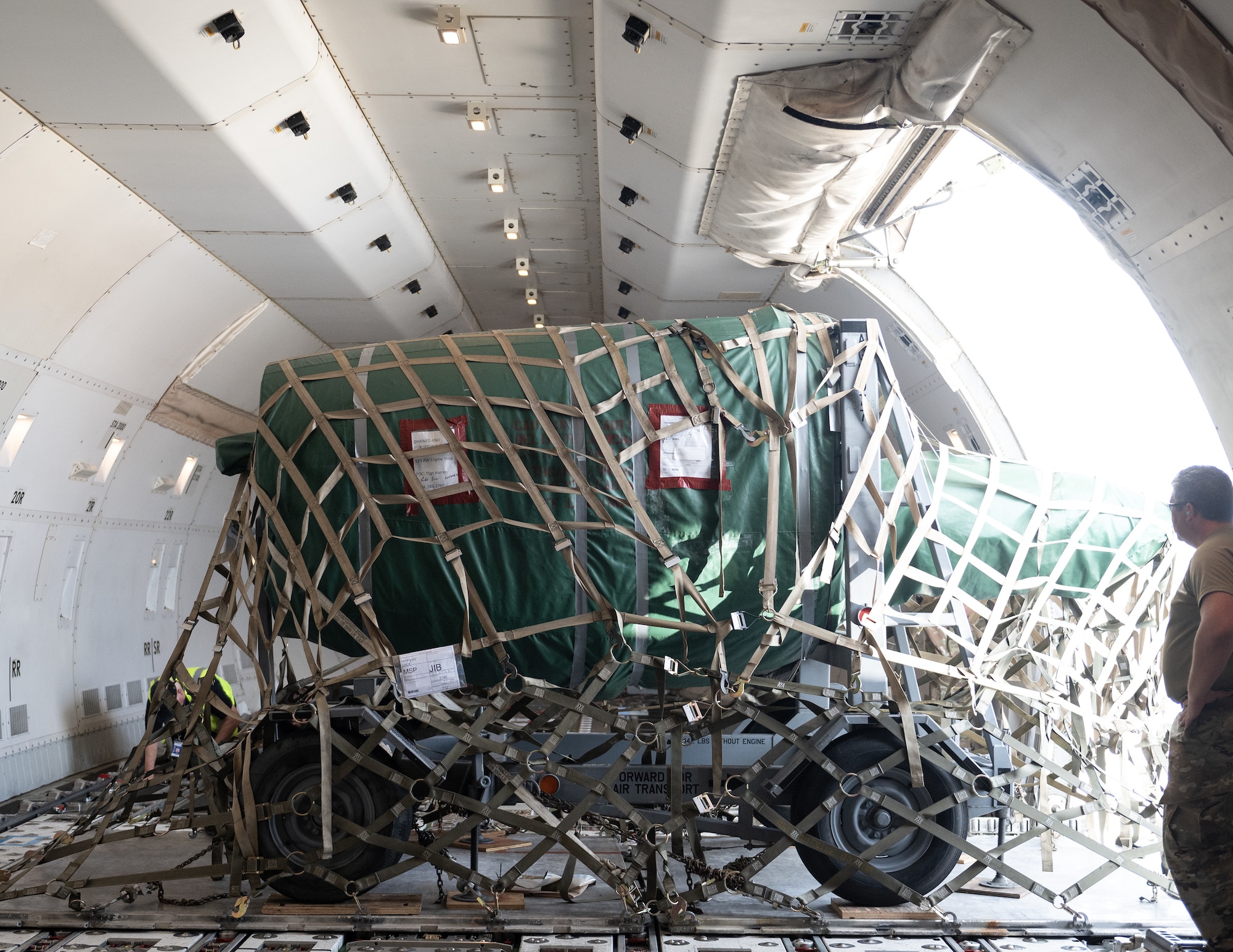 U.S. Air Force Airmen from the 133rd Aerial Transportation Function load cargo onto a Boeing 747 transport aircraft in St. Paul, Minn., Aug. 24, 2023.