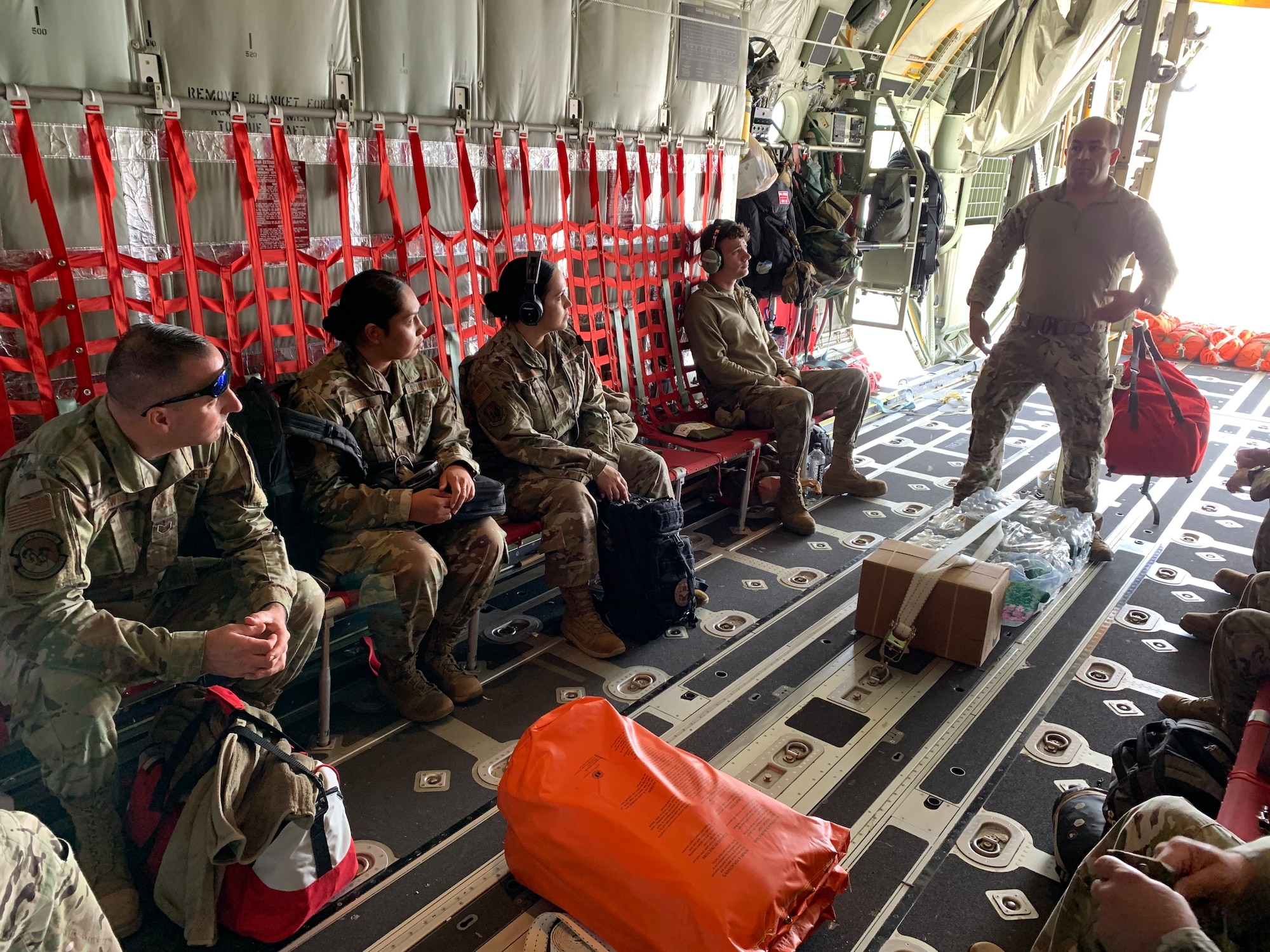 U.S. Air Force National Guardsmen with the 106th Rescue Wing listening to instructions given by C-130J Combat King II loadmaster Tech. Sgt. Steven Benza June 21, 2023 at F.S Gabreski Air National Guard Base, Westhampton Beach, New York. The Airmen were preparing to be scanners for the missing Titan submarine in support of the Coast Guard. (U.S. Air Force National Guard photo by Capt Campbell)