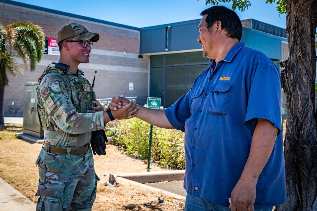 A soldier speaks with a community member.