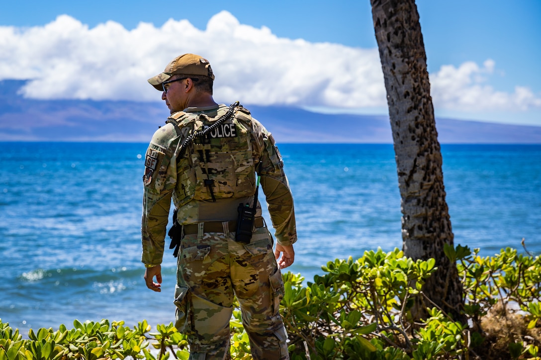 An airman patrols an area while on security watch.