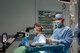 Two ophthalmologists perform a manual small incision cataract surgery in an operating room at a patient in Santiago de Veraguas, Panama.