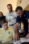 Admiral Zukunft briefs a few Parish Presidents on the flight plan July 25, 2010. The Parish Presidents, along with the Mayor of the City of New Orleans joined the Admiral on a trip out to the Deepwater Horizon spill site on a HC-144 Ocean Sentry.