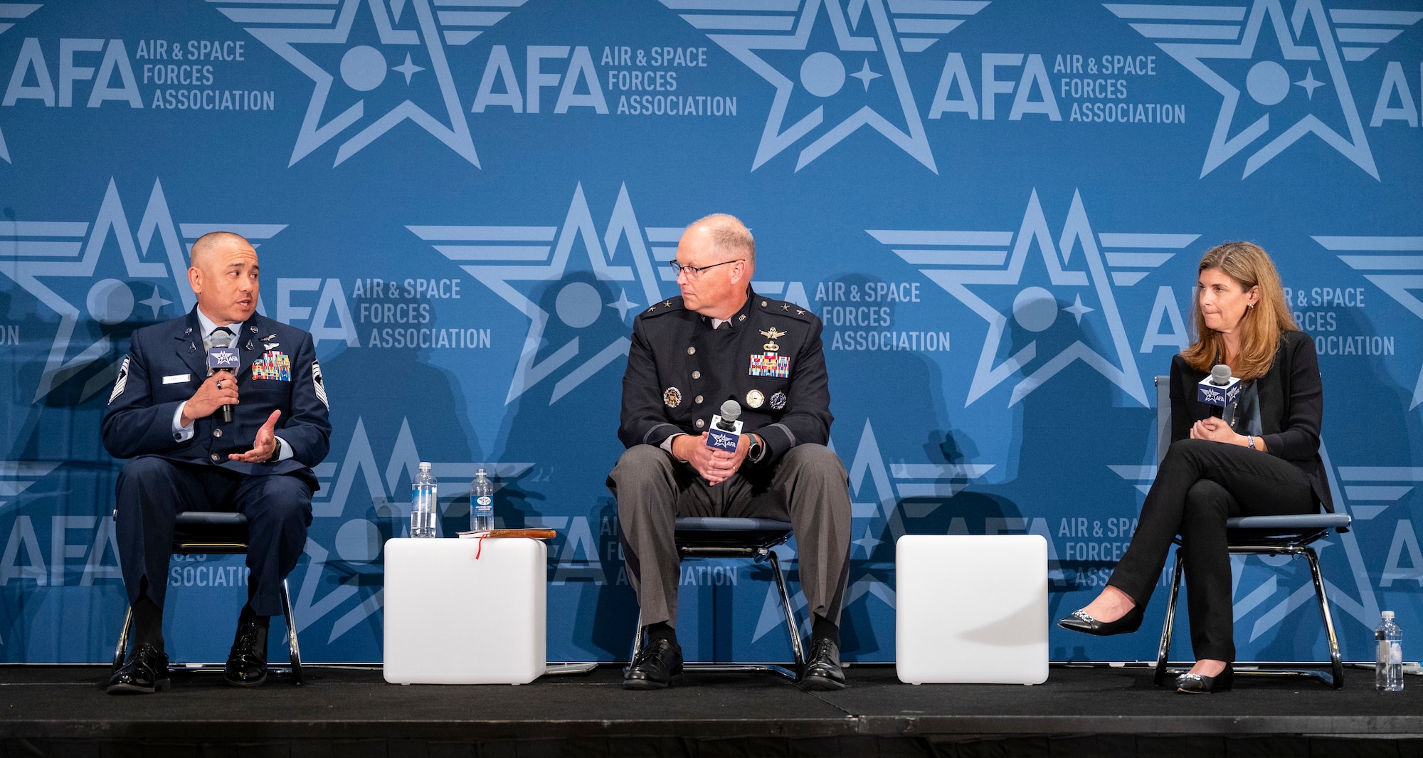 U.S. Space Force Chief Master Sgt. James Seballes, Senior Enlisted Leader of Space Training and Readiness Command, left, addresses attendees during a panel discussion at the Air & Space Forces Association’s 2023 Air, Space & Cyber Conference in National Harbor, Maryland, Sept. 12, 2023. Seballes joined U.S. Space Force Maj. Gen. Steven Whitney, Director of Staff, Headquarters, U.S. Space Force, center, and Katharine Kelley, Deputy Chief of Space Operations for Human Capital, right, on the “Amplifying the Guardian Spirit” panel. (U.S. Air Force photo by 1st Lt. Charles Rivezzo)