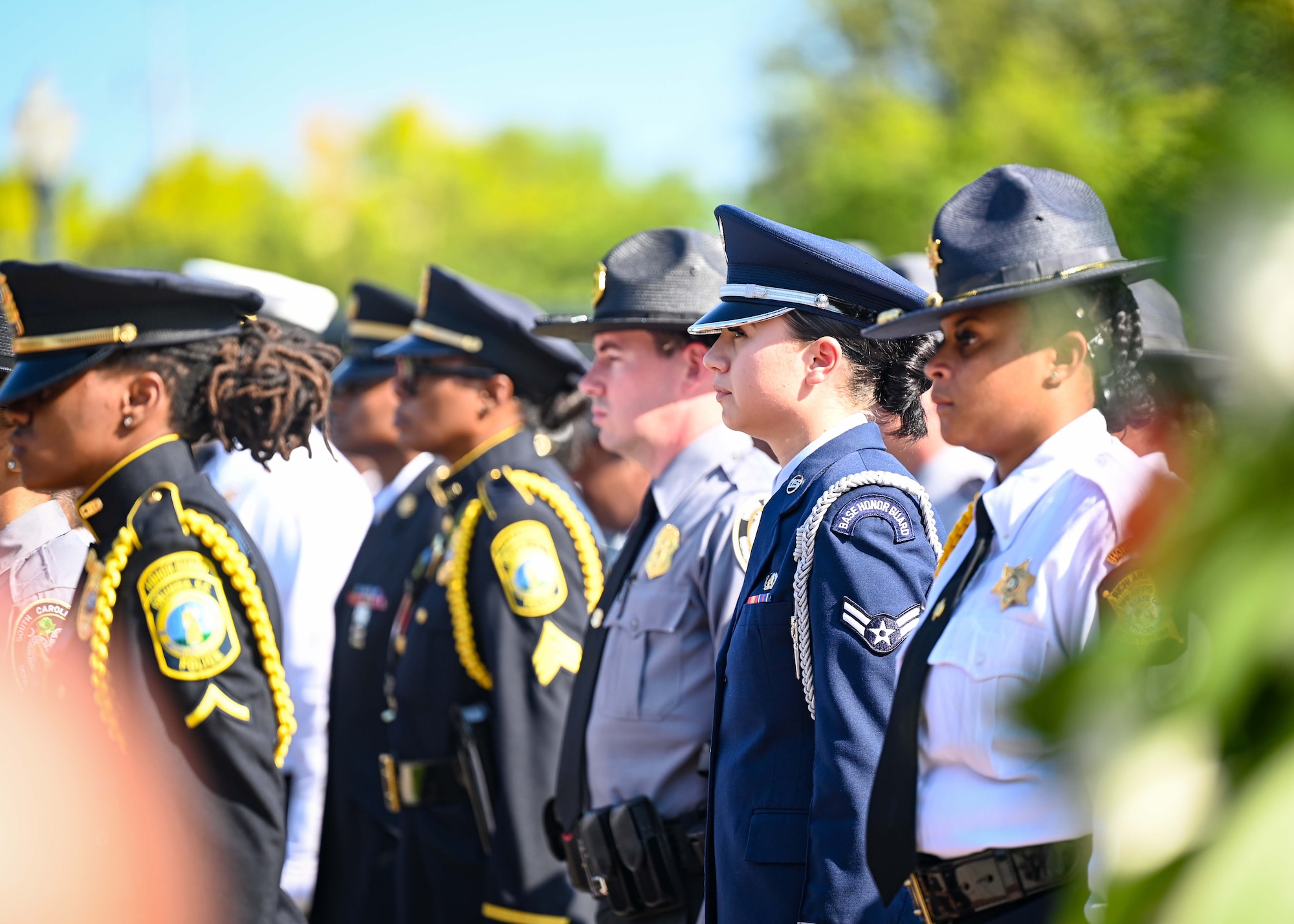 Honor guardsmen stand side by side during a ceremony.