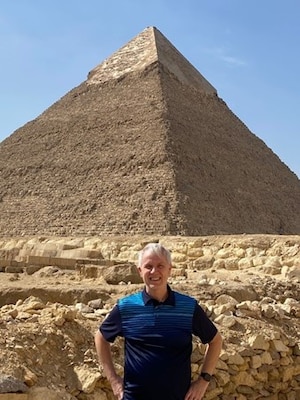Man in front of the pyramid