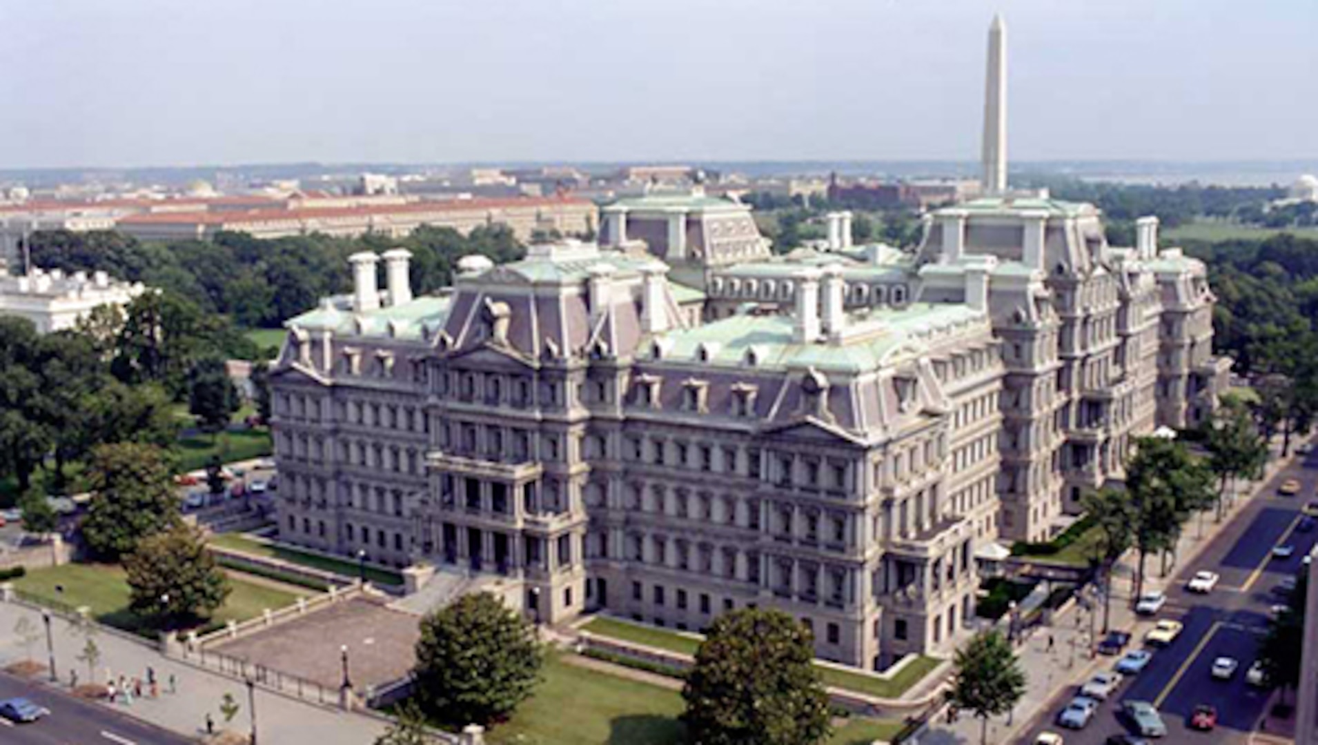 A aerial view of an ornate building in a city.