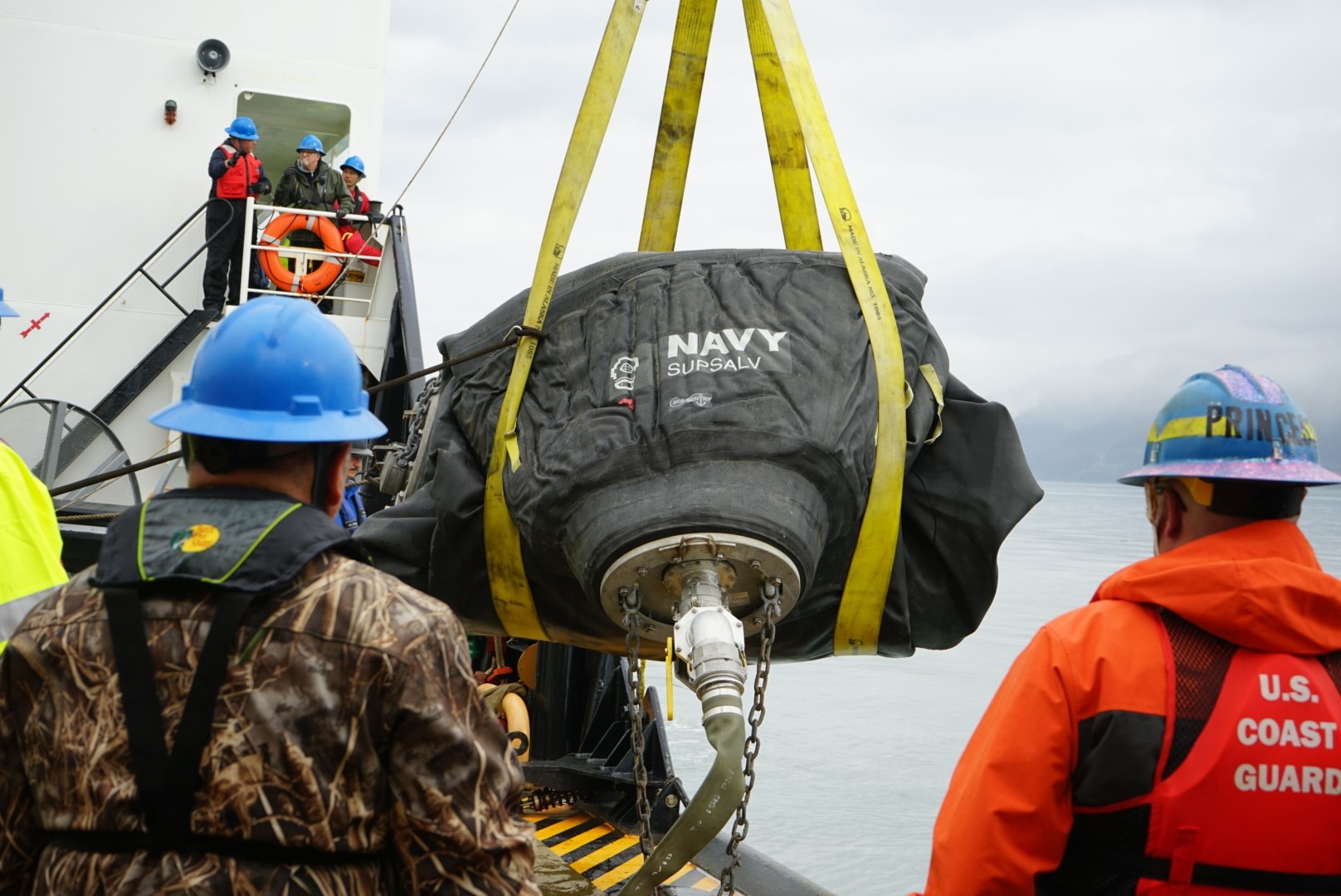 U.S. Coast Guard and U.S. Navy Supervisor of Salvage and Diving members test pollution containment and collection equipment near Seward, Alaska, Aug. 30, 2023.