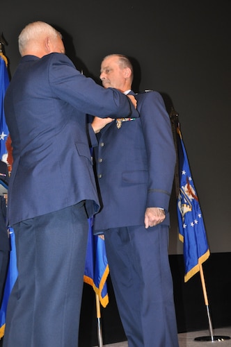 a man receives a medal