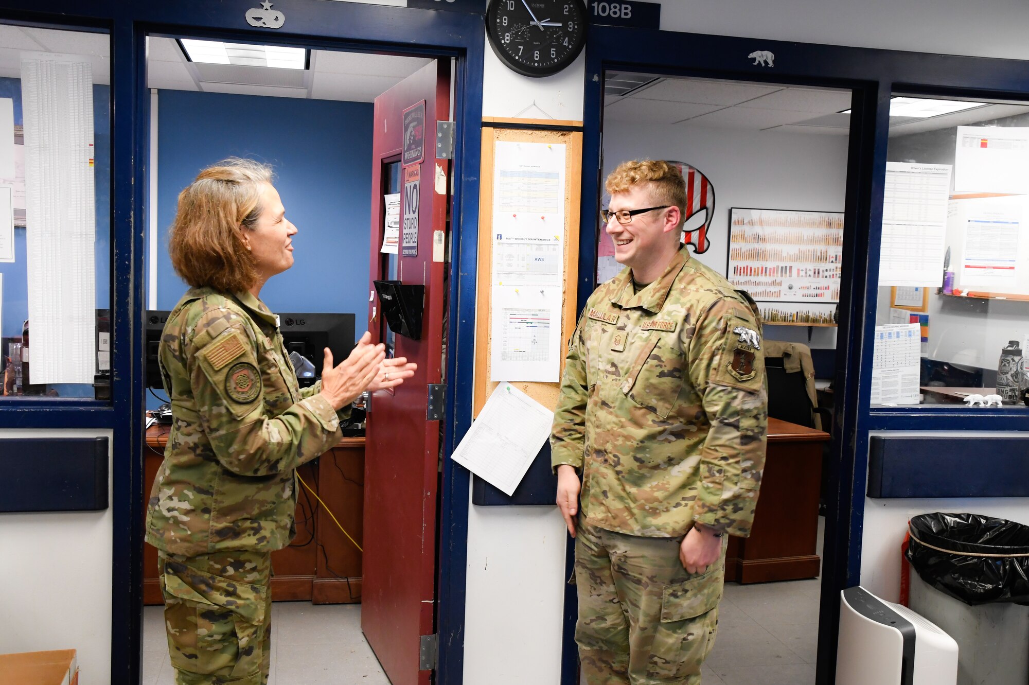 Maj. Gen. Laurie M. Farris, Air National Guard Assistant to the commander, Air Mobility Command, coins Master Sgt. Billie Mallula, a dedicated crew chief with the 168th Maintenance Group, at Eielson Air Force Base, Alaska, August 22, 2023. Farris met with leadership from various organizations, and most of Farris' visit was spent talking with Guardsmen and recognizing their service. (U.S. Air National Guard photo by Senior Master Sgt. Julie Avey)
