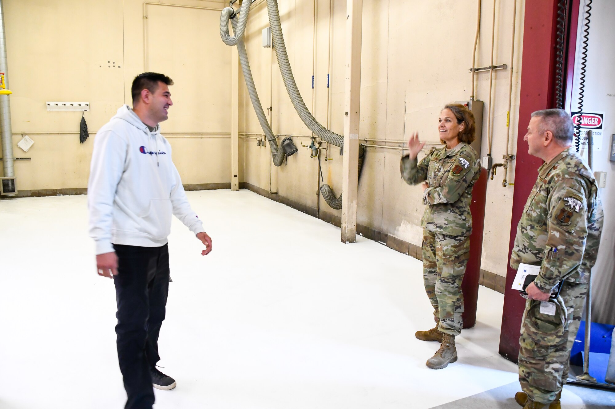 Maj. Gen. Laurie M. Farris, Air National Guard Assistant to the commander, Air Mobility Command, talks with Staff Sgt. Trevor Correa, an Aerospace Ground Equipment Technician with the 168th Maintenance Group, about the self-help project he is working on to improve his shop. Farris met with leadership from various organizations, and most of Farris' visit was spent talking with Guardsmen and recognizing their service. (U.S. Air National Guard photo by Senior Master Sgt. Julie Avey)