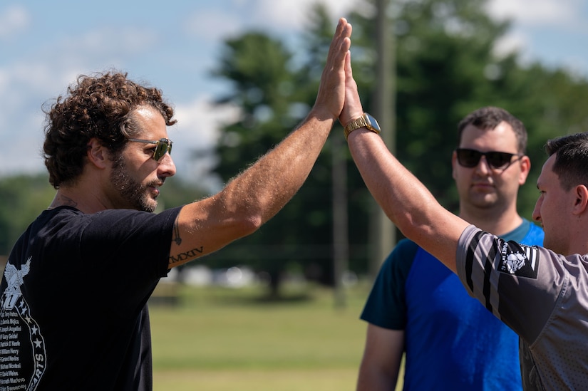 Two men share a high five