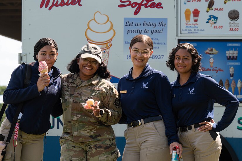 Airmen pose for a photo with ice cream