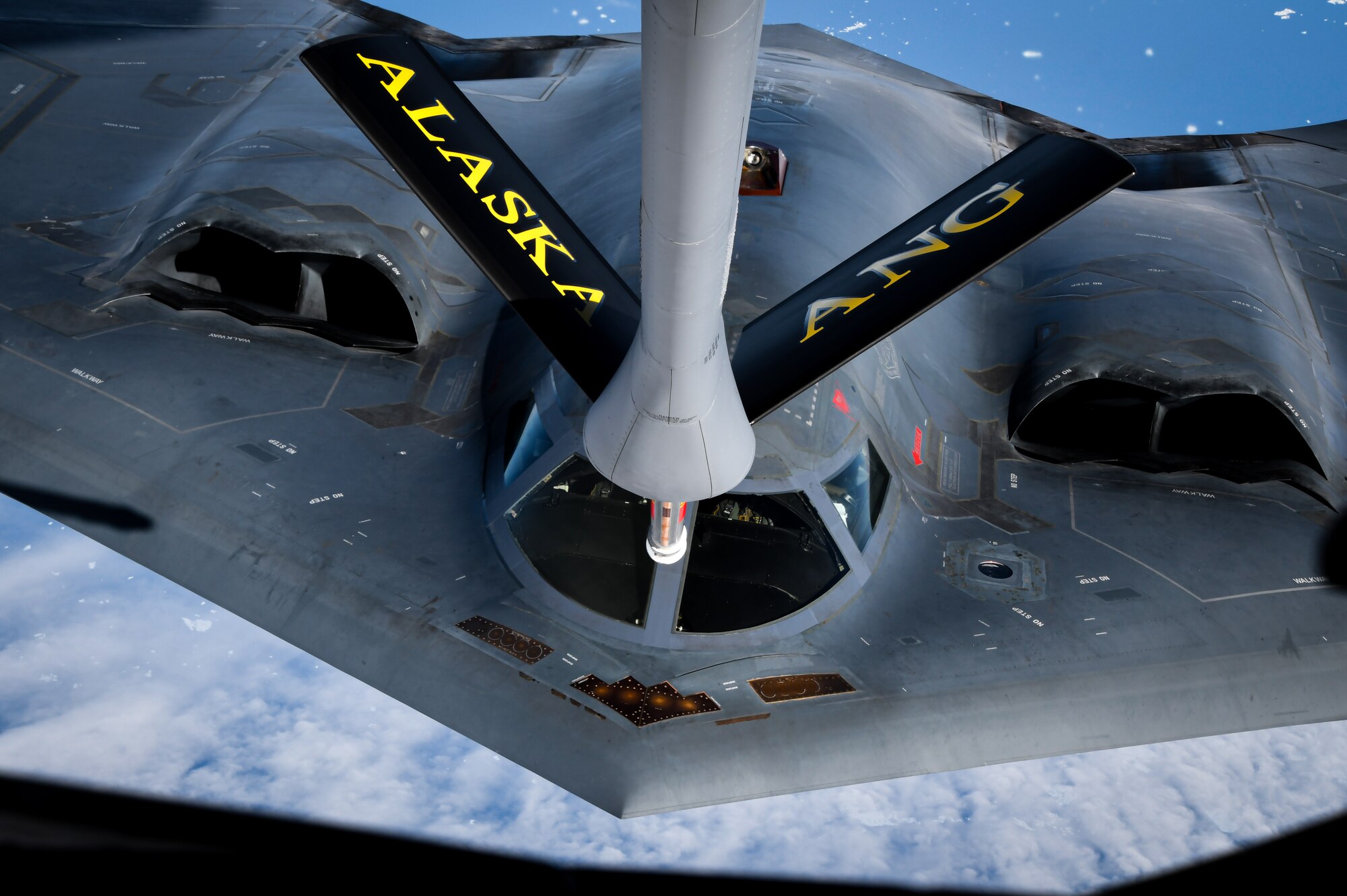 A U.S. Air Force B -2 Spirit Stealth Bomber from Whiteman Air Force Base, Mo., approaches a KC-135 Stratotanker from the 168th Wing, Alaska Air National Guard, during Red Flag Alaska-23 aerial refueling mission over Alaska, August 15, 2023. Red Flag-Alaska provides realistic warfighting training scenarios and prepares Air Force, Joint, and Coalition aircrews to fight against peer-level adversaries in any combat environment. Global reach is an essential aspect of the U.S. military's warfighting ability, and aerial refueling helps to make global reach a reality. (U.S. Air National Guard photo by Senior Master Sgt. Julie Avey)