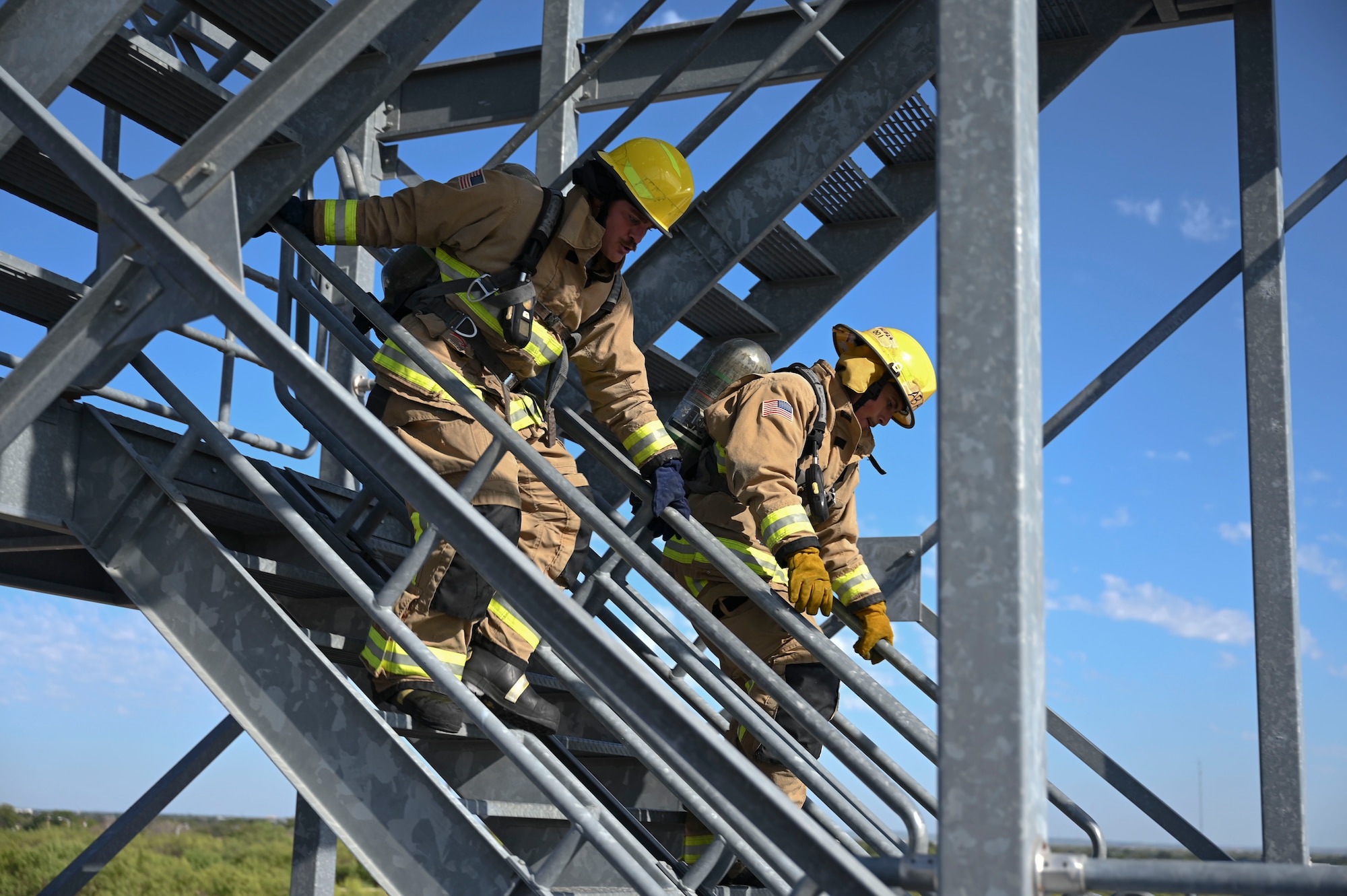 Members assigned to the 312th Training Squadron participate in a combat challenge during the 11th Annual Blood, Sweat and Stairs event at the Louis F. Garland Department of Defense Fire Academy, Goodfellow Air Force Base, Texas, Sept. 9, 2023. Fire academy students went head-to-head with their instructors and peers to compete for the title of Combat Challenge Champions. The combat challenge consisted of challenges that simulated different challenges firefighters faced while responding to the 9/11 terrorist attacks. (U.S. Air Force photo by Airman 1st Class Madison Collier)