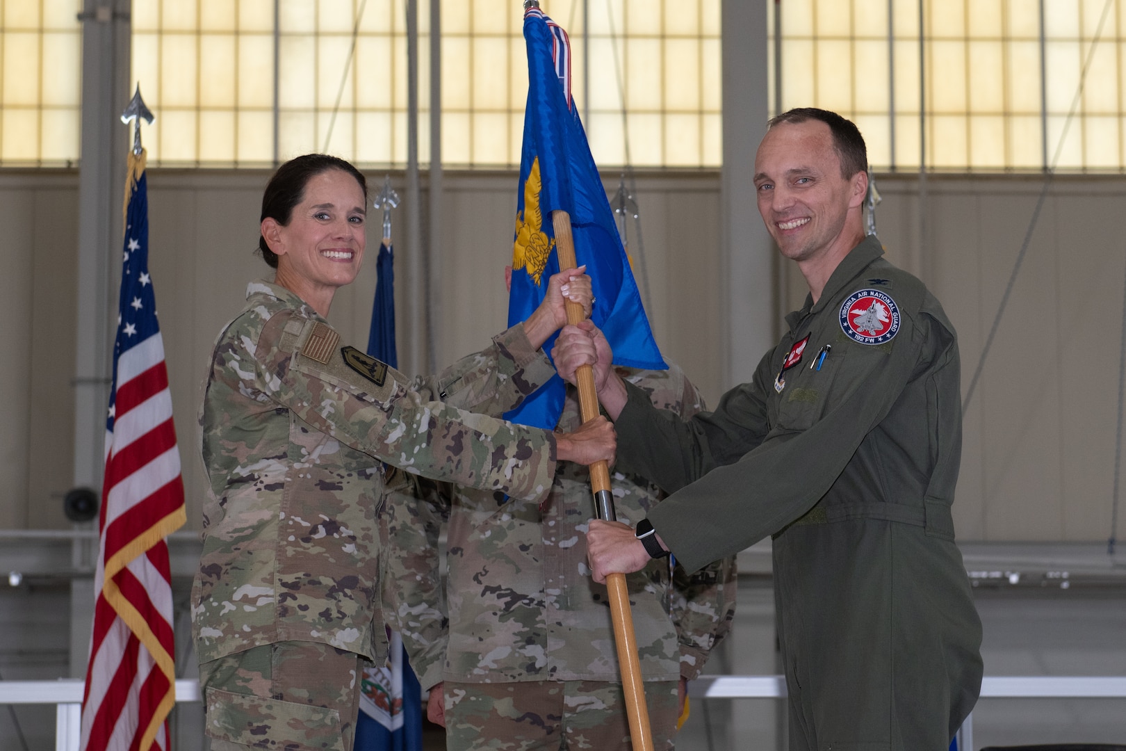 Brig. Gen. Jumper hands 192nd Wing guidon to Col. Lange.