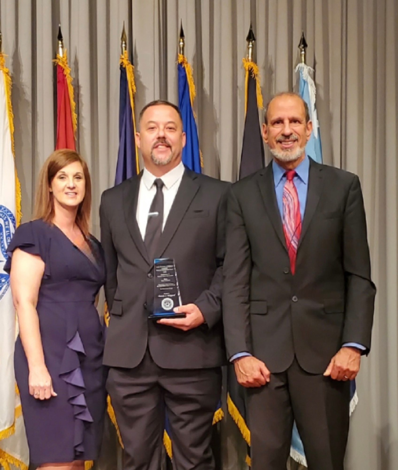 Dennis Waigand, 7th Maintenance Group budget analyst, receives the Under Secretary of Defense Comptroller Financial Management Award for Contributions to Taxpayer Dollar Optimization in Washington, D.C., Aug. 30, 2023. The award recognizes individuals who made significant contributions to improve budget and execution processes through cost innovation, performance and risk evaluation or by building a high-integrity finance control environment. (Courtesy photo)