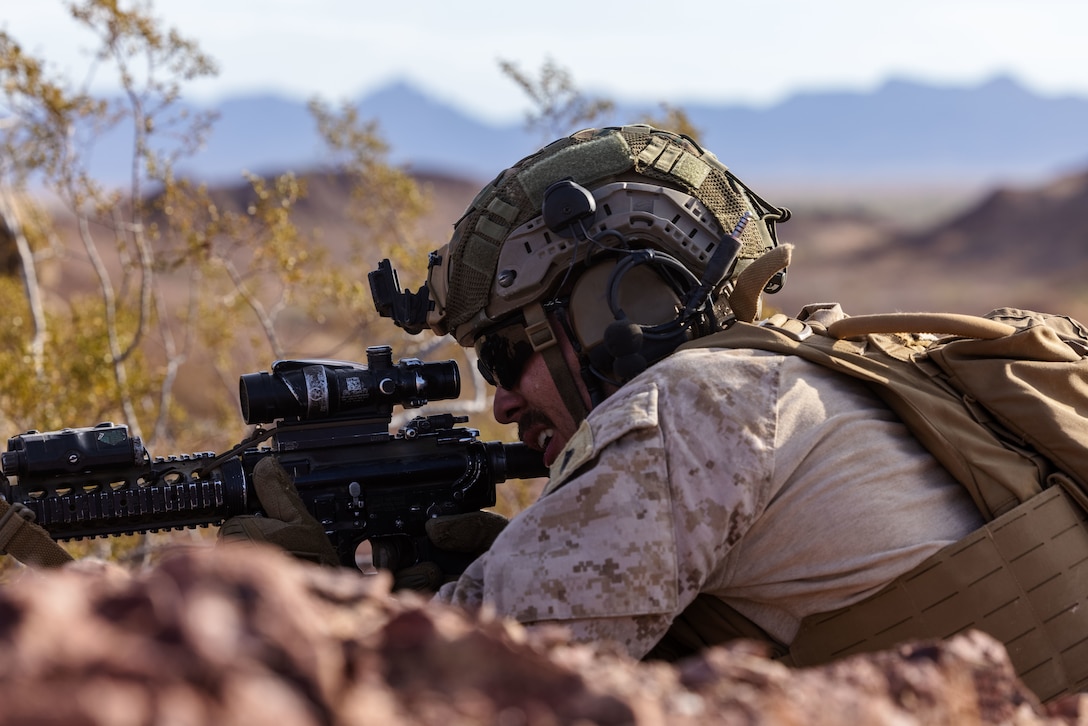 U.S. Marine Corps Cpl. Joel Bennick, a team leader assigned to Alpha Company, Battalion Landing Team 1/5, 15th Marine Expeditionary Unit, lays suppressing fire at enemy targets while conducting a live-fire fire team maneuver range during Realistic Urban Training exercise at Yuma Proving Grounds, Arizona, Aug. 18, 2023. RUT is a land-based predeployment exercise which enhances the integration and collective capability of the Marine Air-Ground Task Force while providing the 15th MEU an opportunity to train and execute operations in an urban environment. (U.S. Marine Corps photo by Lance Cpl. Peyton Kahle)
