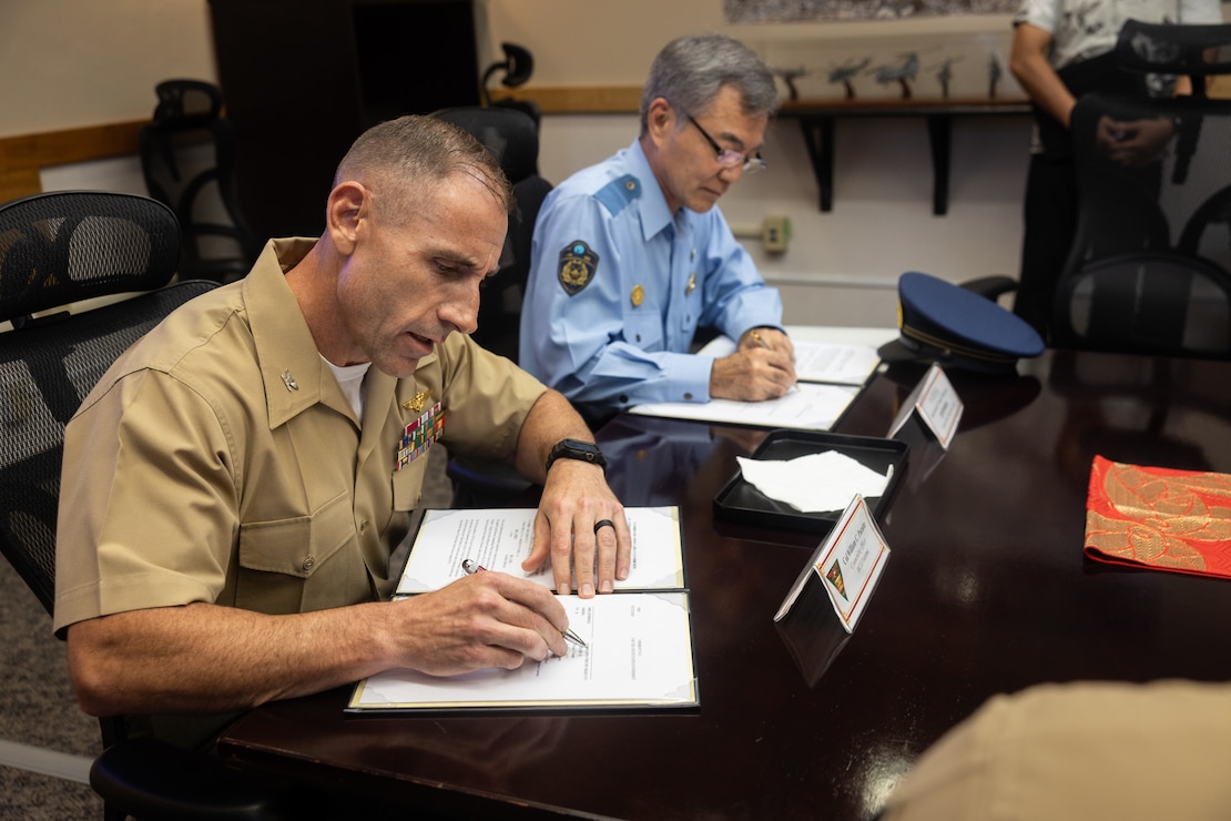 Col Pacatte and Ginowan Police Chief Nakamoto sign a Humanitarian Access Agreement to allow local first responders access to the air station in the event of an emergency.