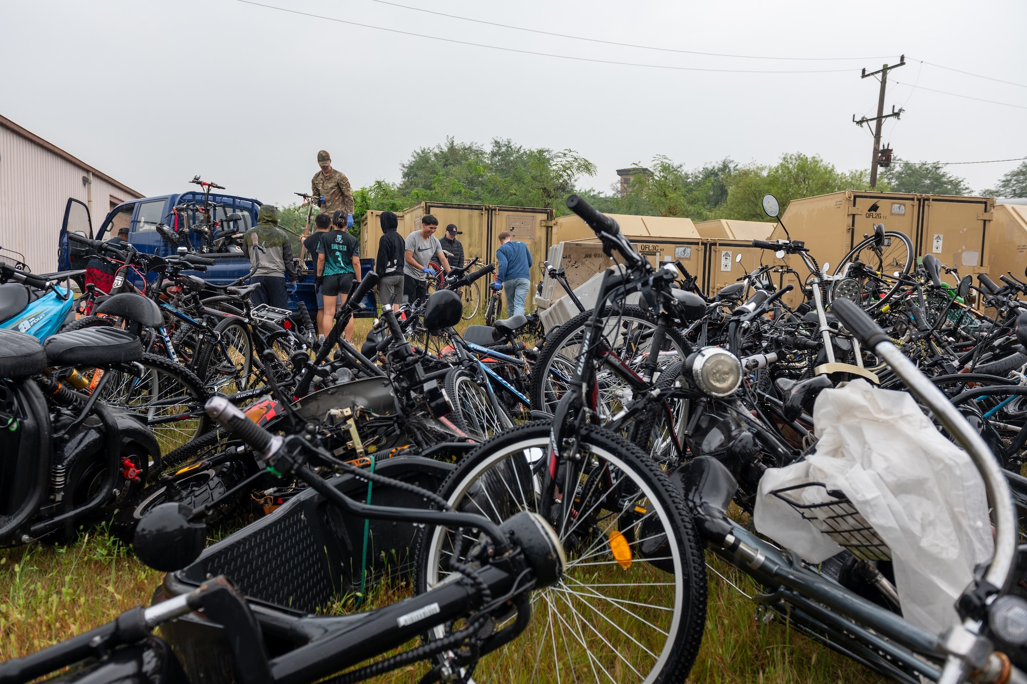 Members of the 51st Security Forces Squadron team up to gather abandoned and inoperable scooters and bicycles around the installation during a base clean up at Osan Air Base, Republic of Korea, Sept. 13, 2023. Throughout the installation, Airmen and civilians worked together to remove litter, gather recyclables, and clear debris, with the intent to maintain environmental standards and invest in the base’s infrastructure. (U.S. Air Force photo by Tech. Sgt. Zachariah Lopez)