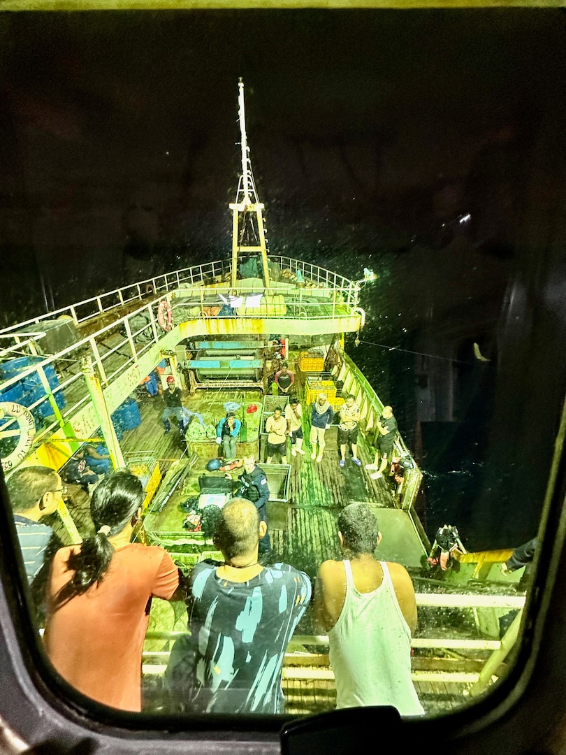 The crew of a People’s Republic of China-flagged fishing vessel look on as members of USCGC Myrtle Hazard (WPC 1139) and an officer from the Papua New Guinea Defence Force conduct a fisheries boarding during a combined patrol on Sept. 1, 2023, in the Coral Sea off Papua New Guinea. The U.S. Coast Guard was in Papua New Guinea at the invitation of the PNG government to join their lead in maritime operations to combat illegal fishing and safeguard marine resources following the recent signing and ratification of a bilateral maritime law enforcement agreement between the United States and Papua New Guinea. (U.S. Coast Guard photo by Chief Warrant Officer Sara Muir)