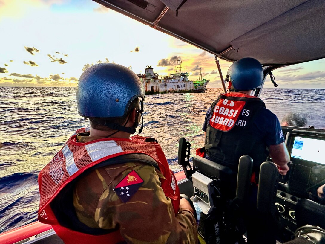 A USCGC Myrtle Hazard (WPC 1139) boarding team and an officer from the Papua New Guinea Defence Force conduct a horseshoe of a People’s Republic of China-flagged fishing vessel during a combined patrol on Sept. 1, 2023, in the Coral Sea off Papua New Guinea. The U.S. Coast Guard was in Papua New Guinea at the invitation of the PNG government to join their lead in maritime operations to combat illegal fishing and safeguard marine resources following the recent signing and ratification of a bilateral maritime law enforcement agreement between the United States and Papua New Guinea. (U.S. Coast Guard photo by Chief Warrant Officer Sara Muir)