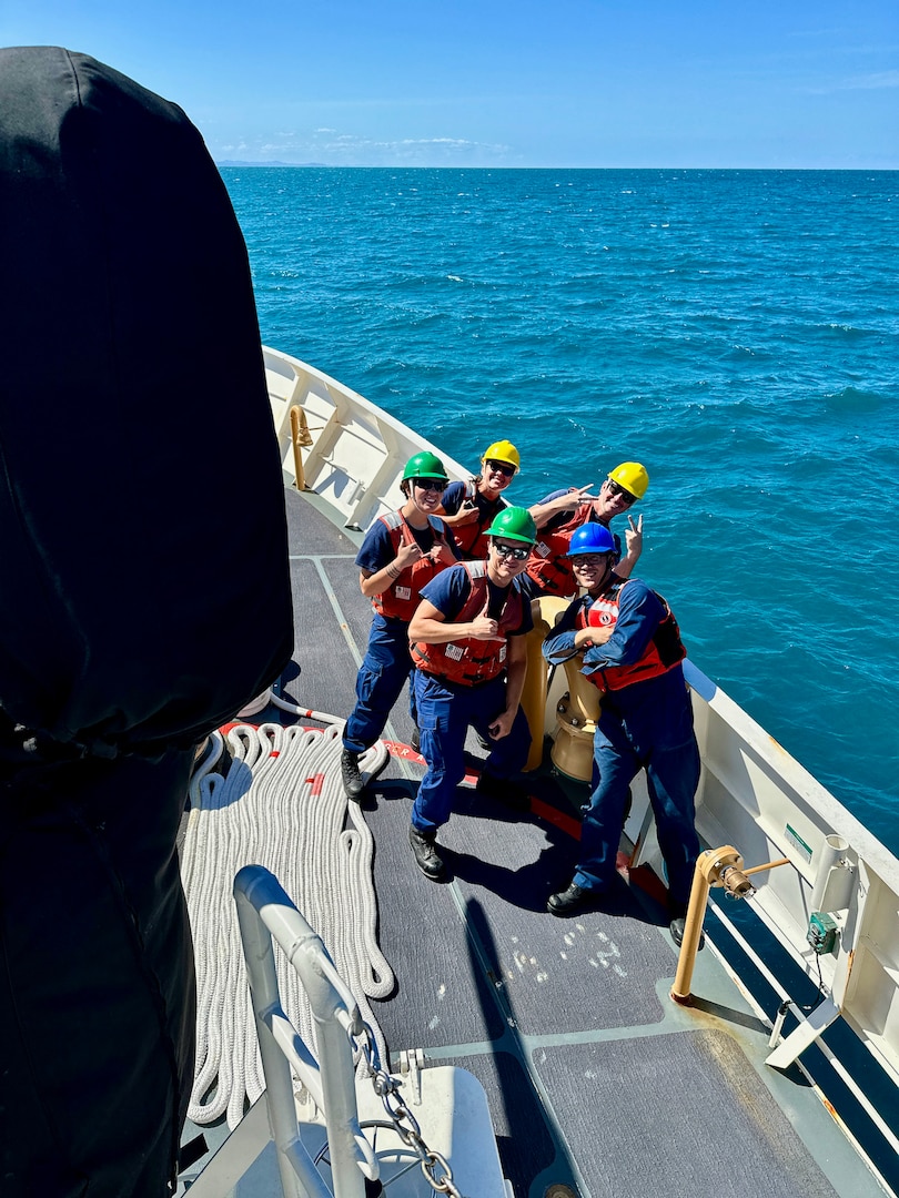 The anchor detail on USCGC Myrtle Hazard (WPC 1139) takes a moment for a photo as they depart Port Moresby for the second leg of a combined patrol on Aug. 31, 2023, in the Coral Sea off Papua New Guinea. The U.S. Coast Guard was in Papua New Guinea at the invitation of the PNG government to join their lead in maritime operations to combat illegal fishing and safeguard marine resources following the recent signing and ratification of a bilateral maritime law enforcement agreement between the United States and Papua New Guinea. (U.S. Coast Guard photo by Chief Warrant Officer Sara Muir)