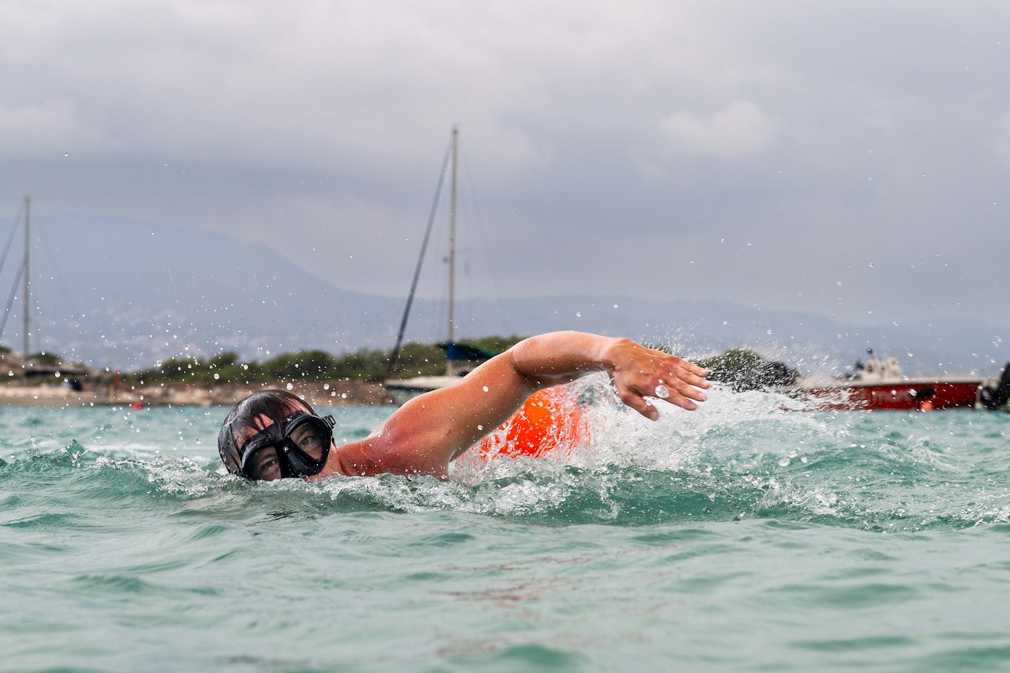 Competitors affiliated with Navy Support Activity Souda Bay, NATO and Hellenic armed forces take part in a 2-kilometer swim as part of the 20th Eco-Challenge event hosted by NSA Souda Bay and organized and executed by the Morale, Welfare and Recreation team on Sept. 9, 2023.