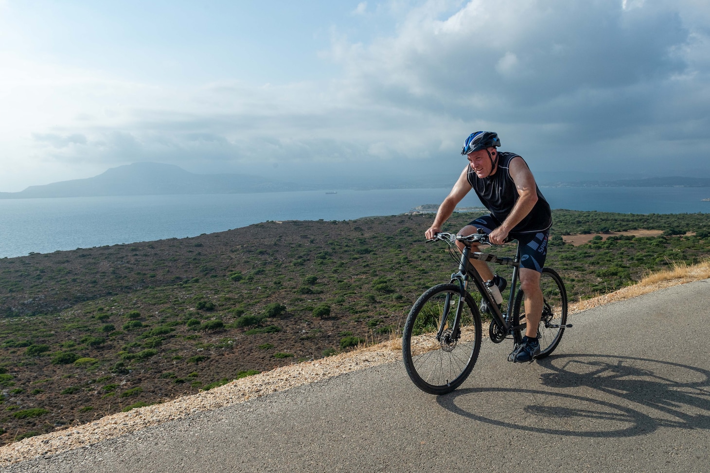 Rear Adm. Brad J. Collins, commander, Navy Region Europe, Africa, Central, prepares to compete in a 38.5-kilometer cycle as part of the 20th Eco-Challenge event hosted by NSA Souda Bay and organized and executed by the Morale, Welfare and Recreation team on Sept. 9, 2023.