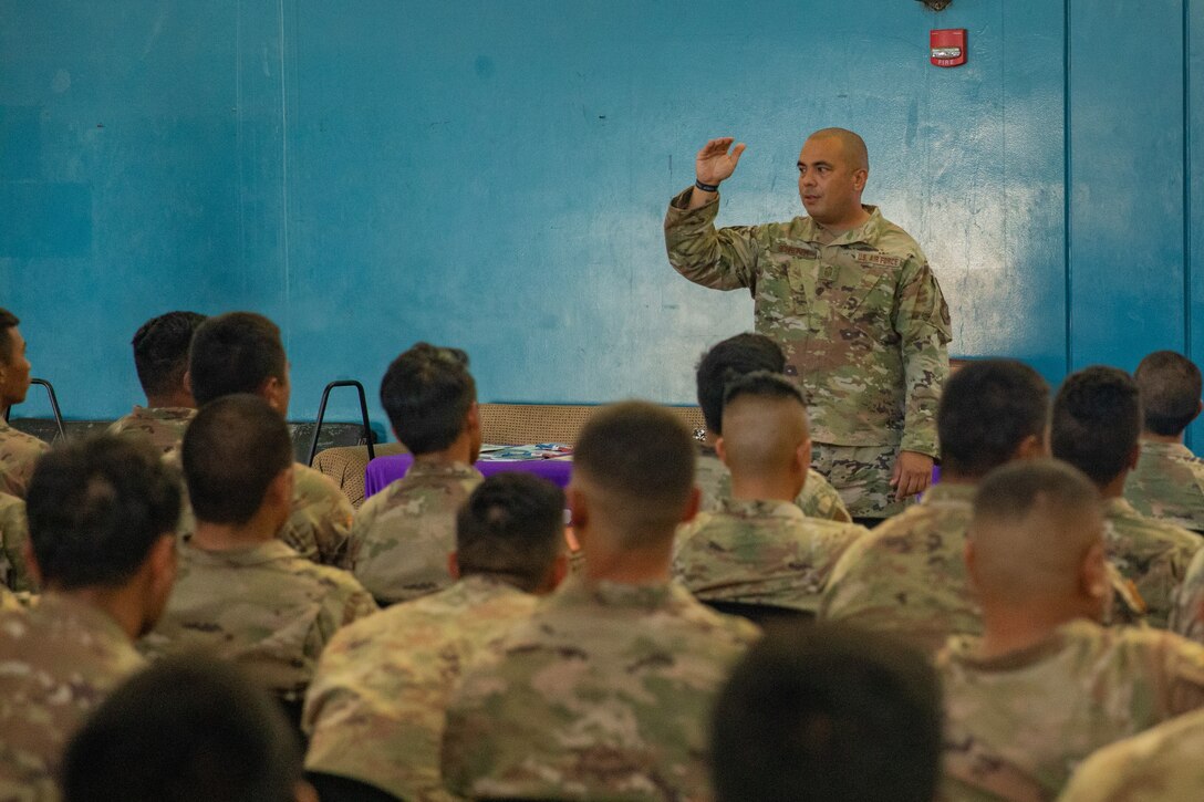 A soldier conducts communication training for service members.