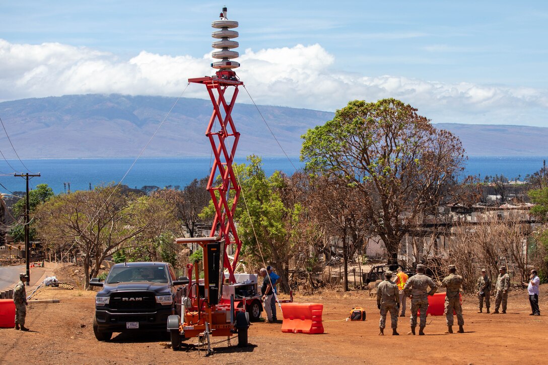 Soldiers set up a rapid response emergency siren.