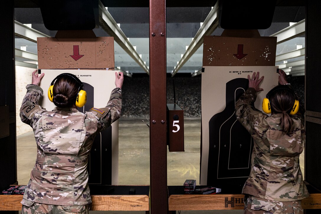 Two soldiers position targets.