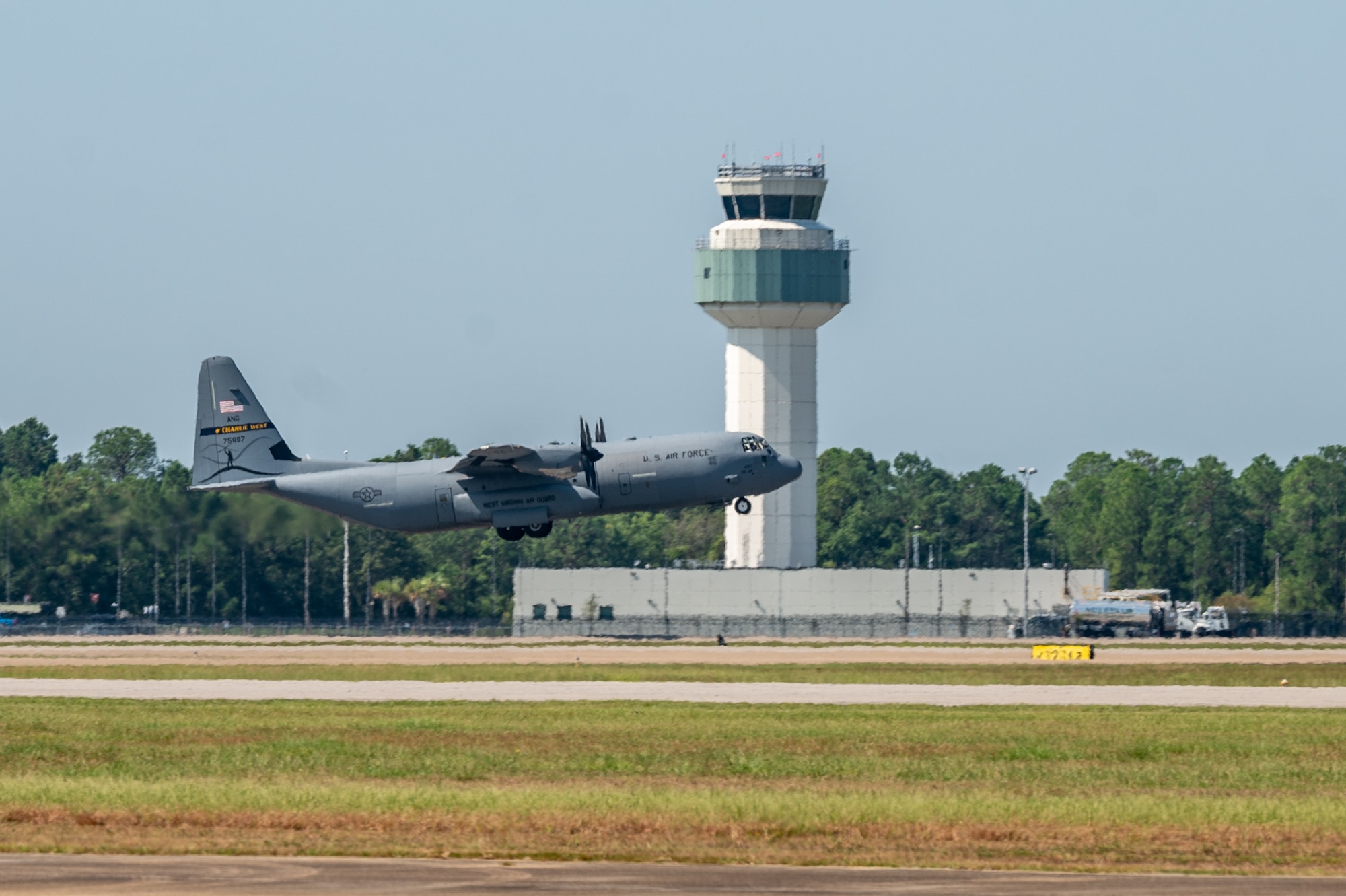 A C-130J-30 assigned to the 130th Airlift Wing, McLaughlin Air National Guard Base, W.Va., takes off during the unit's Fly Away Readiness Exercise Validation (FLARE-V) held at the Gulfport Combat Readiness Training Center (CRTC), Gulfport, Miss Sept. 8, 2023. FLARE-V is a part of the Air Forces' larger mechanism of continuous assessment by the wing, the MAJCOM, and the service through a series of evaluative events, including scalable wing-level exercises, joint exercises, complex and operationally informed training events, real-world deployments and the validation of readiness reporting procedures. (U.S. Air National Guard photo by 2nd Lt. De-Juan Haley)
