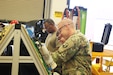 Sgt. 1st Class Thomas Hardy talks Sgt. Ismael Valadez through the importance of troubleshooting equipment. Instructors from the 94th Training Division graduated their newest class of Wheeled Vehicle Mechanics (91B) from the 91B Advanced Leader Course (ALC) at the 80th Training Command’s Regional Training Site Maintenance – Devens.