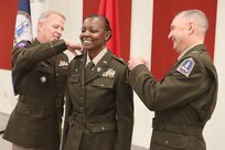 Djuana L. Goodwin is promoted to chief warrant officer 5 May 18, 2023, at the Virginia National Guard Sgt. Bob Slaughter Headquarters at Defense Supply Center Richmond, Virginia. Maj. Gen. Timothy P. Williams, the Adjutant General of Virginia, presided over the ceremony and administered the oath of office to Goodwin. Williams was joined by Brig. Gen. James W. Ring, the VNG Director of the Joint Staff, to pin on the new rank. Goodwin was the first Black woman promoted to warrant officer 1 in the VNG in 2001, and she is the first Black woman to be promoted to chief warrant officer 5. (U.S. National Guard photo by Cotton Puryear)