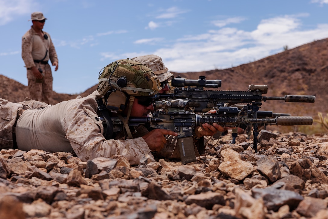 U.S. Marine Corps Sgt. Bryan Leon, a squad leader assigned to Weapons Company, Battalion Landing Team 1/5, 15th Marine Expeditionary Unit, sights in with an M4 carbine for a battle sight zero range during Realistic Urban Training exercise at Yuma Proving Grounds, Arizona, Aug. 16, 2023. RUT is a land-based predeployment exercise which enhances the integration and collective capability of the Marine Air-Ground Task Force while providing the 15th MEU an opportunity to train and execute operations in an urban environment. (U.S. Marine Corps photo by Lance Cpl. Kahle)