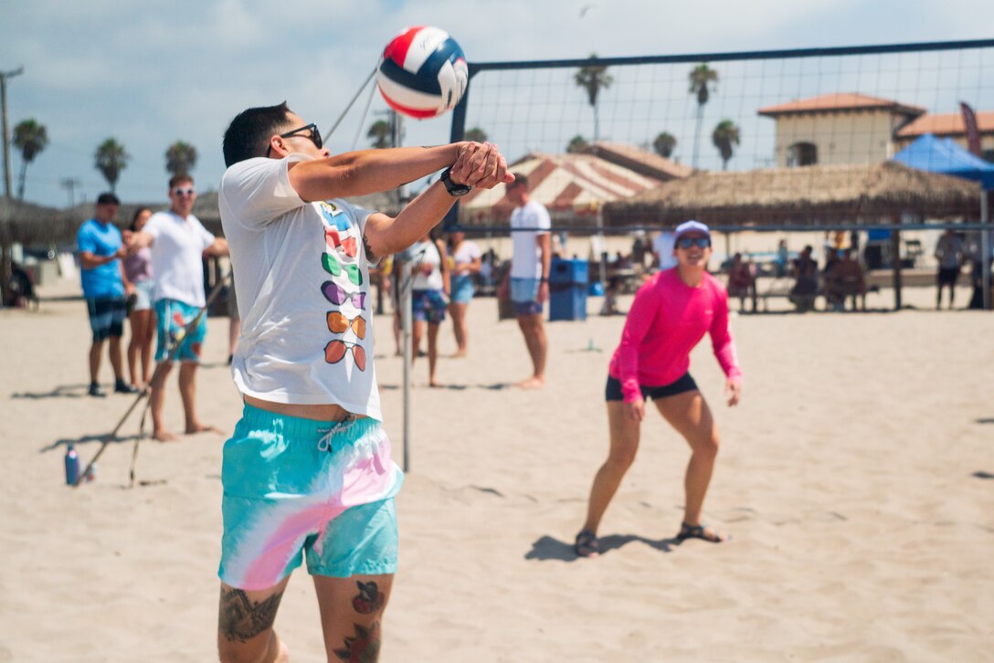 U.S. Marines assigned to the 15th Marine Expeditionary Unit (MEU) compete in a unit volleyball tournament at Del Mar Beach, Marine Corps Base Camp Pendleton, California, August 20, 2022. The 15th MEU beach bash is an event that brings families, currently serving members of the 15th MEU, and 15th MEU veterans together to build camaraderie, engage in friendly competition and stay connected to our veteran community. (U.S. Marine Corps photo by Cpl. Garrett Kiger)