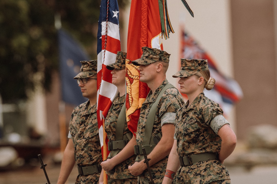 U.S. Marines assigned to the 15th Marine Expeditionary Unit stand with the colors during the 15th MEU composite ceremony at Marine Corps Base Camp Pendleton, California, June 14, 2023. The ceremony served the official start of the MEU’s training cycle, during which the 15th MEU command element gained the subordinate elements of Battalion Landing Team 1/5, Combat Logistics Battalion 15, and Marine Medium Tiltrotor Squadron (VMM) 165, forming a Marine Air-Ground Task Force. (U.S. Marine Corps photo by Sgt. Sydney Smith)