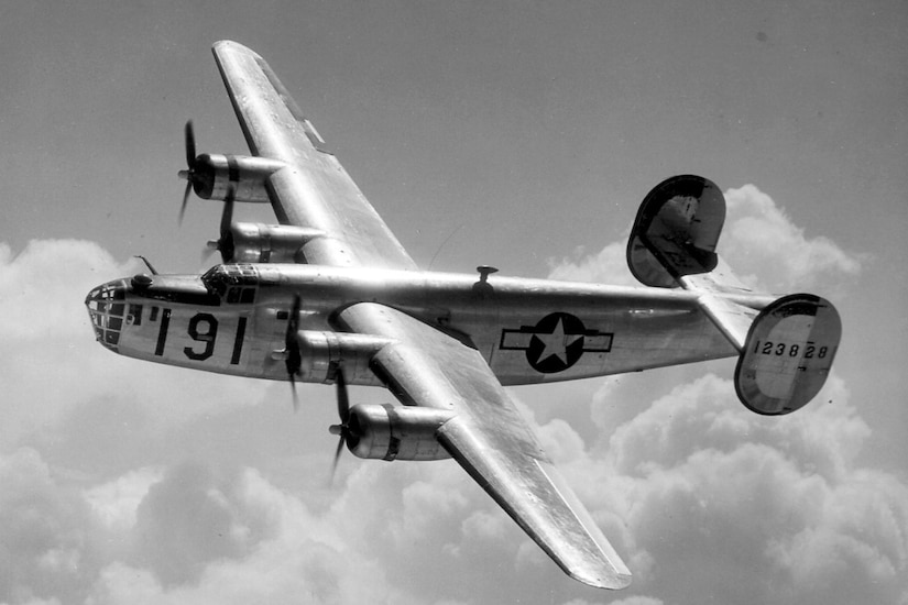 A propeller plane flies through the air.