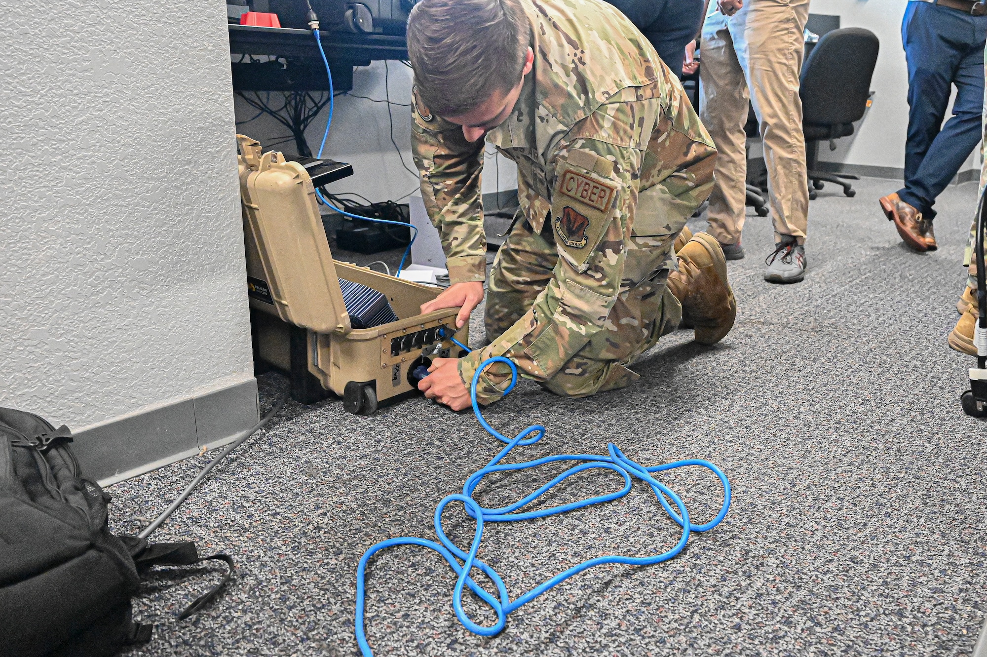 Pictured above is a man setting up wires.