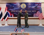 U.S. Air Force Brig. Gen. Gent Welsh, Washington Air National Guard commander, and Royal Thai Air Force Group Captain Nat Kamintra, exercise director, shake hands after formally opening Enduring Partners 2023 at Korat Air Base, Kingdom of Thailand, Sept. 11, 2023. The Kingdom of Thailand and the Washington and Oregon Air National Guard will practice aerial refueling and fighter tactics during the exercise.