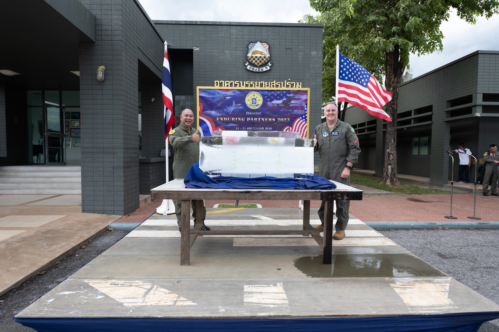 U.S. Air Force Brig. Gen. Gent Welsh, Washington Air National Guard commander, and Royal Thai Air Force Group Captain Nat Kamintra, exercise director, give a thumbs up during the opening ceremonies of Enduring Partners 2023, Korat Air Base, Kingdom of Thailand, September 11, 2023. The exercise is a joint exercise between the Kingdom of Thailand, the Washington and Oregon Air National Guard. The Washington National Guard has a long-standing State Partnership with the Kingdom of Thailand. (U.S. Air Force photo by Tech. Sgt. Michael L. Brown)