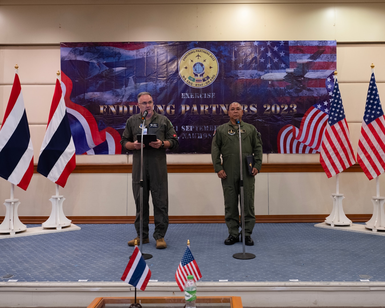 U.S. Air Force Brig. Gen. Gent Welsh, Washington Air National Guard commander, and Royal Thai Air Force Group Captain Nat Kamintra give comments during the opening ceremony of Enduring Partners 2023, Korat Air Base, Kingdom of Thailand, September 11, 2023. The exercise is a joint exercise between the Kingdom of Thailand, the Washington and Oregon Air National Guard. The Washington National Guard has a long-standing State Partnership with the Kingdom of Thailand. (U.S. Air Force photo by Tech. Sgt. Michael L. Brown)