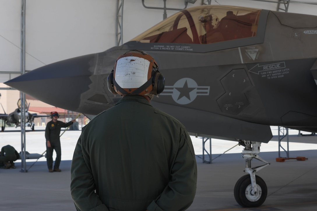 U.S. Marine Corps Lt. Col. Jesse M. Peppers, commanding officer, Marine Fighter Attack Squadron (VMFA) 211, conducts a pre-flight check at Marine Corps Air Station Yuma, Arizona, Aug. 28, 2023. U.S. Marine Corps Brig. Gen. Robert B. Brodie, assistant wing commander, 3rd Marine Aircraft Wing, visited the air station to observe operations and training at VMFA-211 and VMFA-122. (U.S. Marine Corps photo by Lance Cpl. Elizabeth Gallagher)