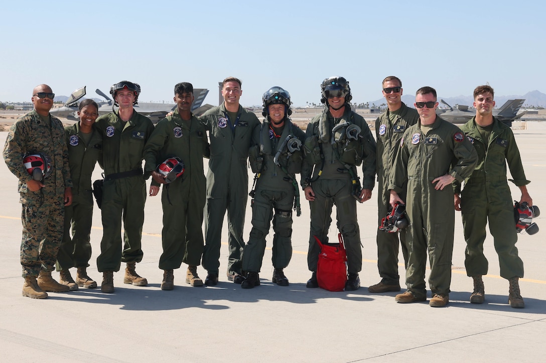 U.S. Marines with Marine Fighter Attack Squadron 122 (VMFA-122), 3rd Marine Aircraft Wing (3rd MAW), pose for a photo with Brig. Gen. Robert B. Brodie, assistant wing commander, 3rd MAW, during his visit at Marine Corps Air Station Yuma, Arizona, Aug. 29, 2023. During his visit to the air station Brodie observed operations and training at VMFA-211 and VMFA-122. (U.S. Marine Corps photo by Lance Cpl. Elizabeth Gallagher)