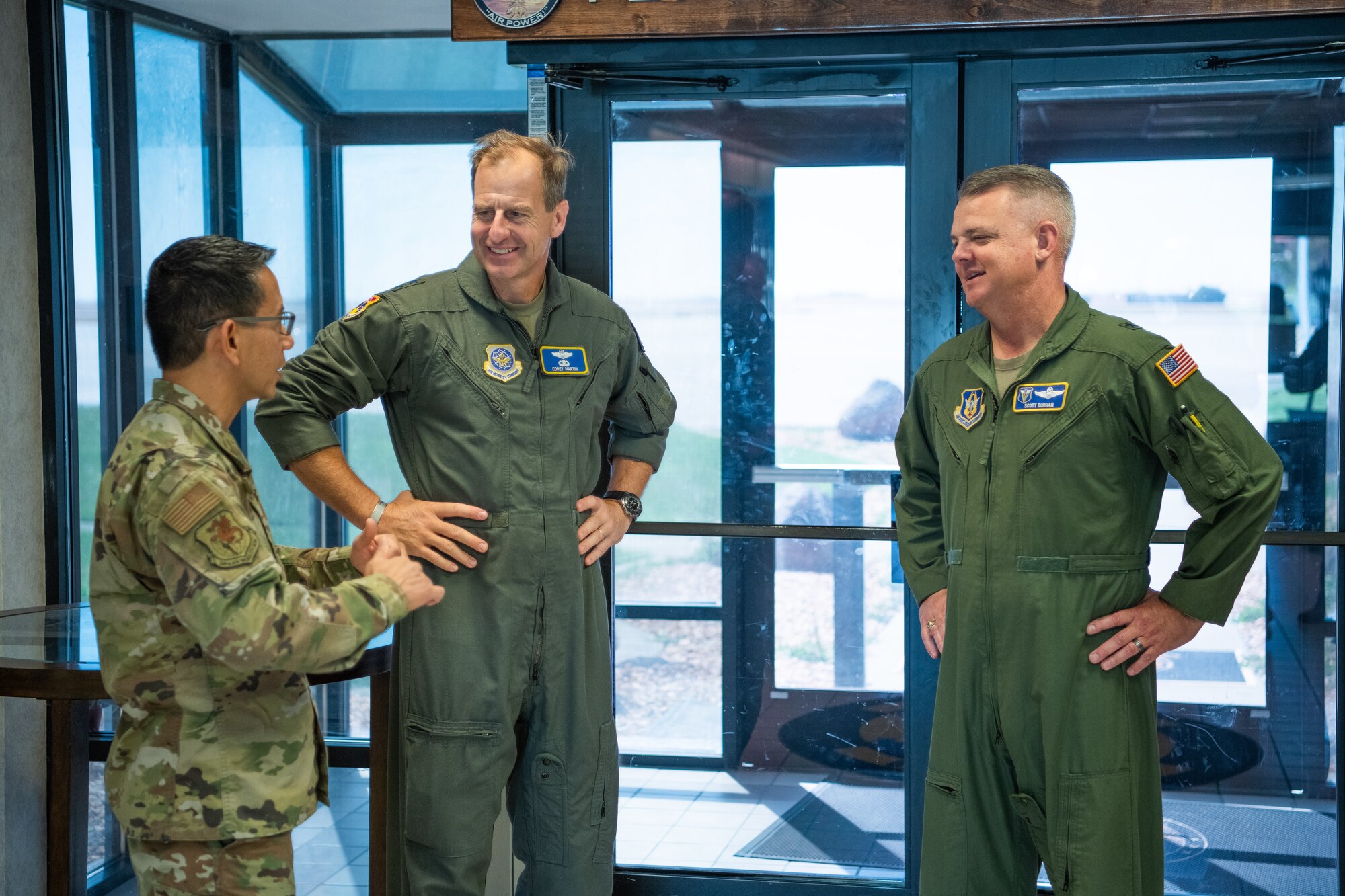 Maj. Gen Corey Martin, 18th AF commander (left) and Brig. Gen. Derin Durham, 4th AF commander,(right) speaking with Lt. Col. Gerard Guevara, 349 AMW, director of inspection during a visit to Travis AFB.